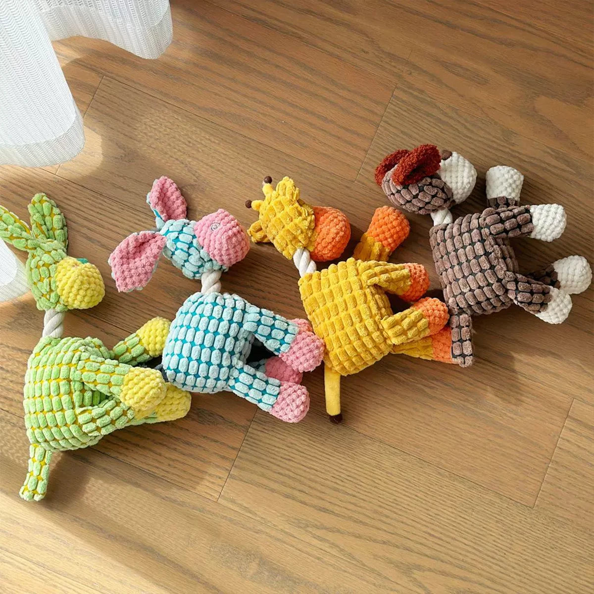 Squeaky Donkey Plush Toy for Dogs - dog playing with plush donkey toy